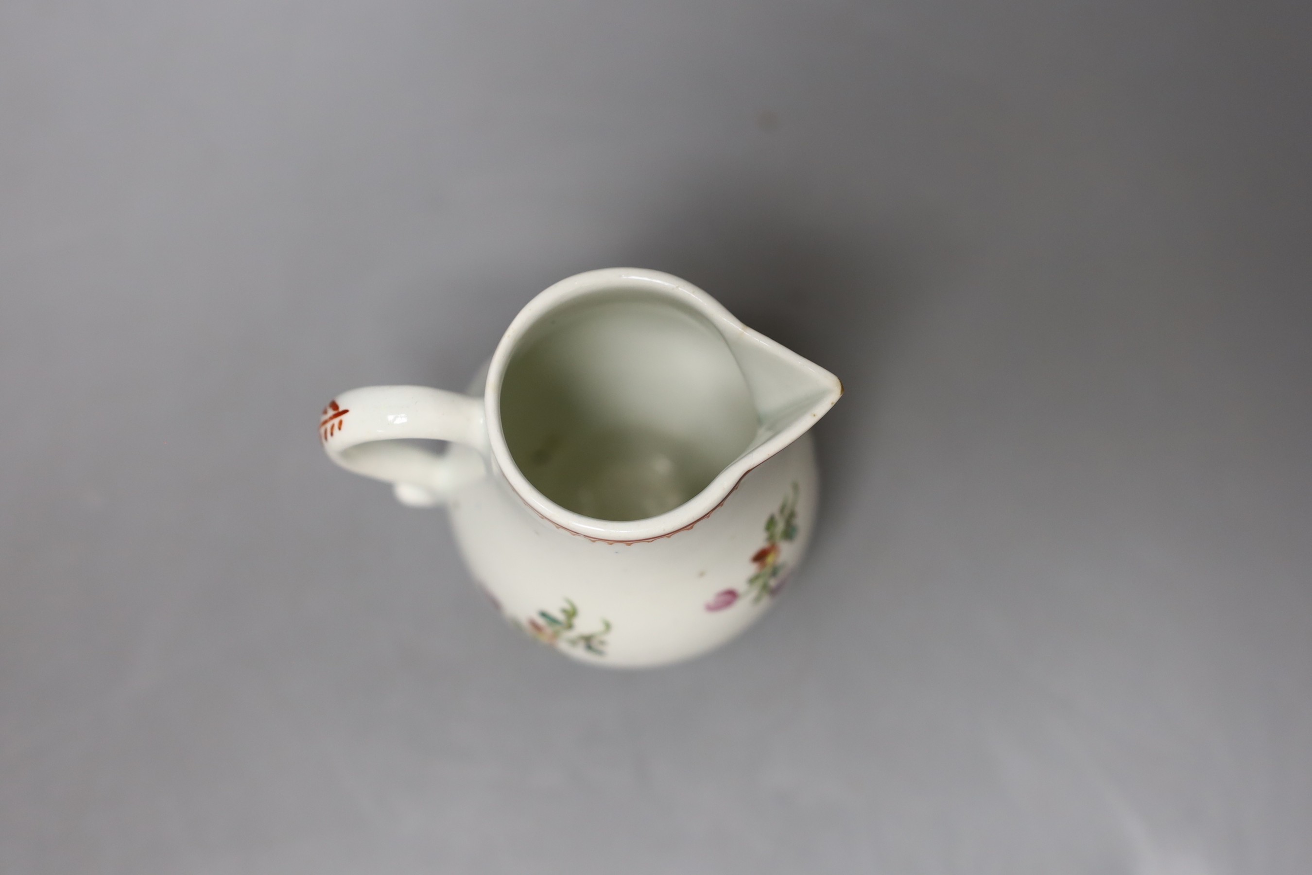 Lowestoft sparrow beak jug painted with a floral spray and scattered sprigs c.1780 - 9.5cm high